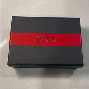 TUMI Gray Box with Red Accent